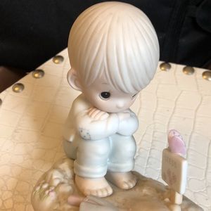 A. Vintage Precious moments figurine